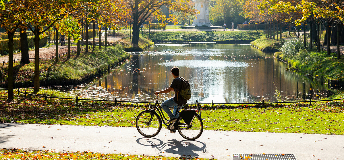 Good for the soul and the environment – riding a bike in Berlin Riding a pushbike in a Berlin park